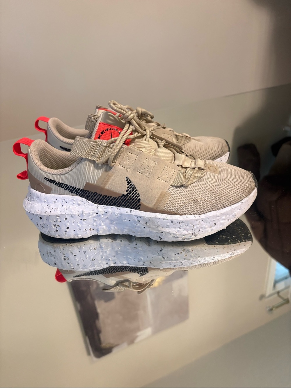 Nike Women's Tan Sneakers with Black Swoosh and Red Accents